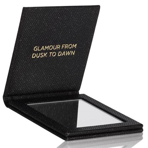 Receive a FREE MICHAEL Michael Kors Compact Mirror with